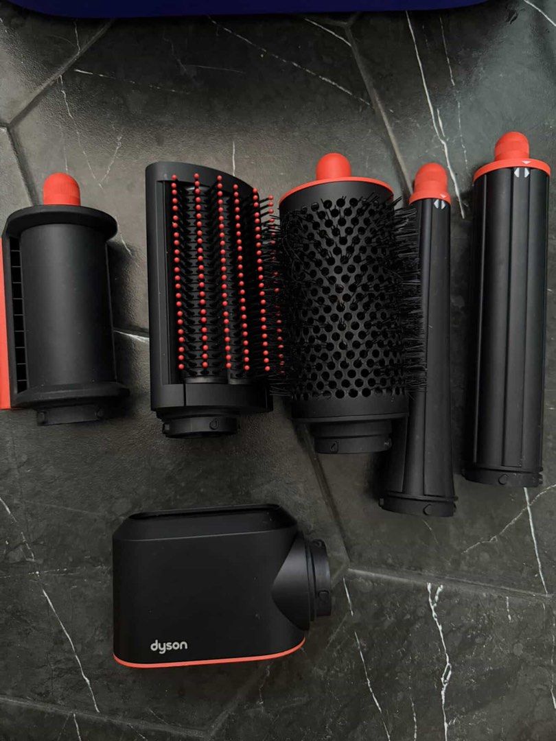 Dyson Airwrap i.d. multi-styler and dryer (Category: Hair) located in Quezon City. Submitted by cheriesonlineshop (Listing ID 1465884628, Image 2). Description: - Authentic Dyson Airwrap i.d. multi-styler in a stunning Mint Green and Orange colorway - Full set complete with all original attachments: styling barrels, round volume brush, smoothing brush, and dryer attachment - Includes the original Dyson presentation storage case - Comes with origi