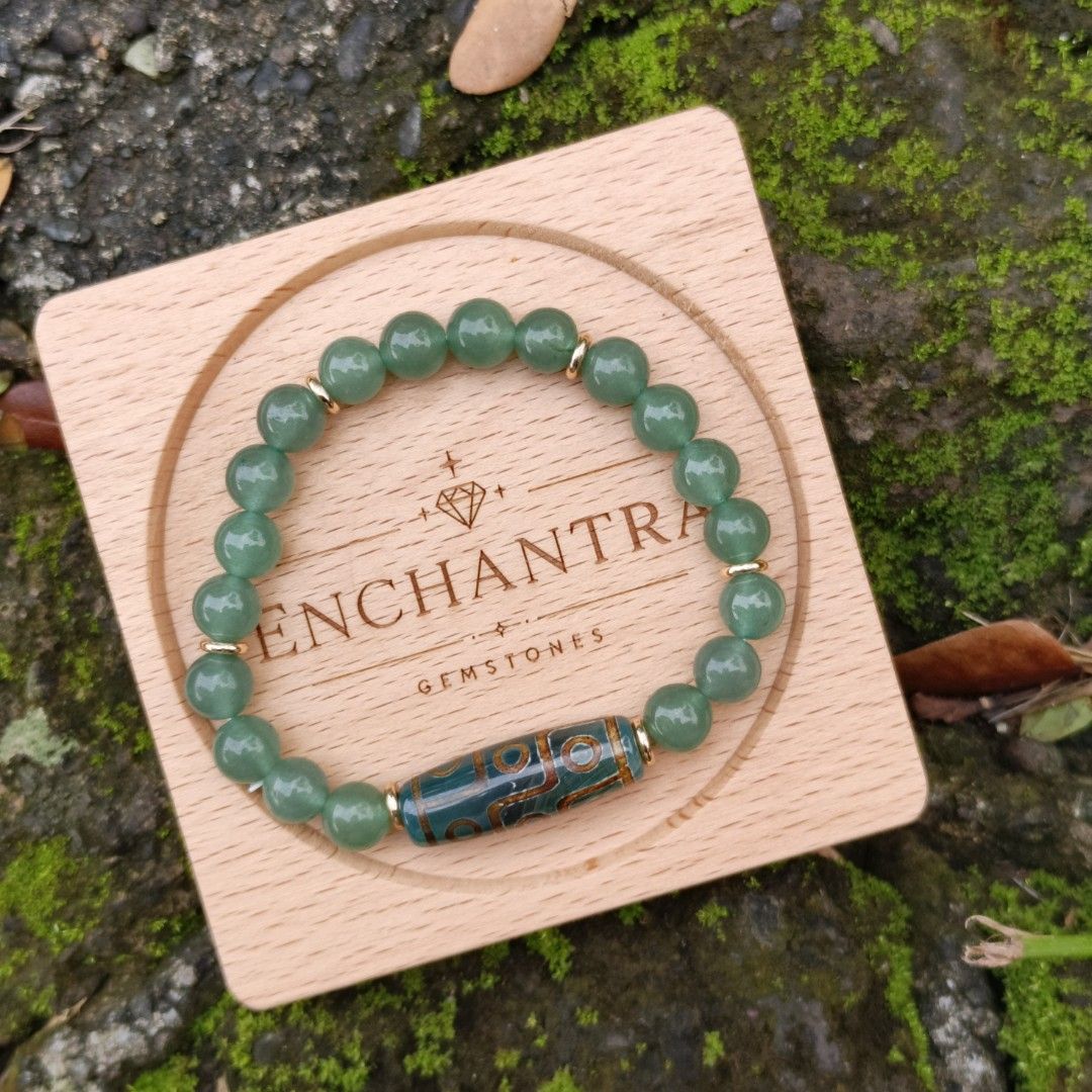 DZI + Aventurine (Category: Bracelets) located in Manila. Submitted by enchantra_gems (Listing ID 1465917128, Image 1). Description: ✨ DZI & AVENTURINE NATURAL STONE BRACELET 💚 A beautiful combination of Aventurine and a DZI bead, blending earthy elegance with timeless style. 💚 Aventurine: Associated with luck, growth & prosperity 🤎 DZI: Traditionally regarded as a symbol of protection & good fortune 📏 Bead Size 8 mm 🤍 Wrist Size: 16-17cm 💰