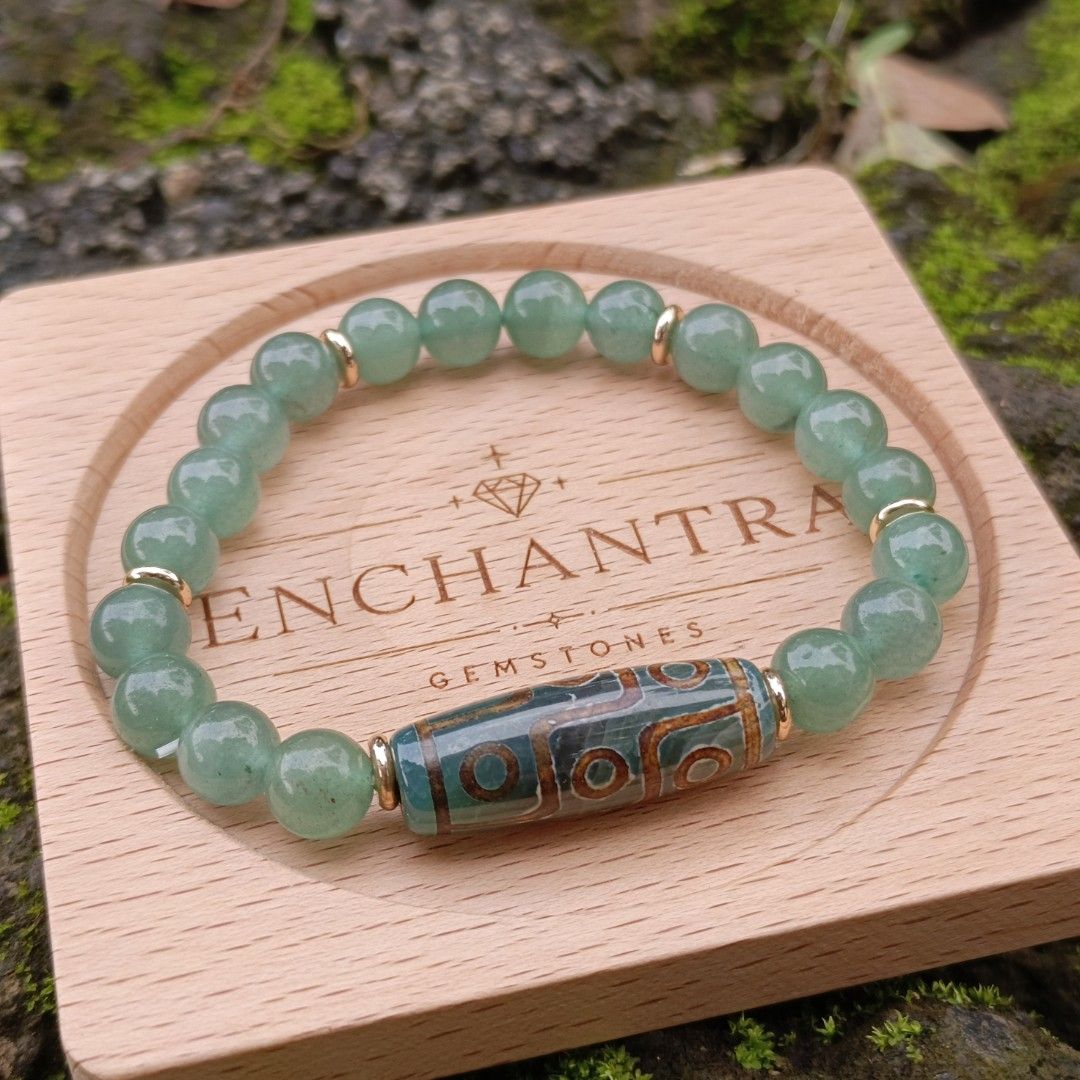 DZI + Aventurine (Category: Bracelets) located in Manila. Submitted by enchantra_gems (Listing ID 1465917128, Image 2). Description: ✨ DZI & AVENTURINE NATURAL STONE BRACELET 💚 A beautiful combination of Aventurine and a DZI bead, blending earthy elegance with timeless style. 💚 Aventurine: Associated with luck, growth & prosperity 🤎 DZI: Traditionally regarded as a symbol of protection & good fortune 📏 Bead Size 8 mm 🤍 Wrist Size: 16-17cm 💰