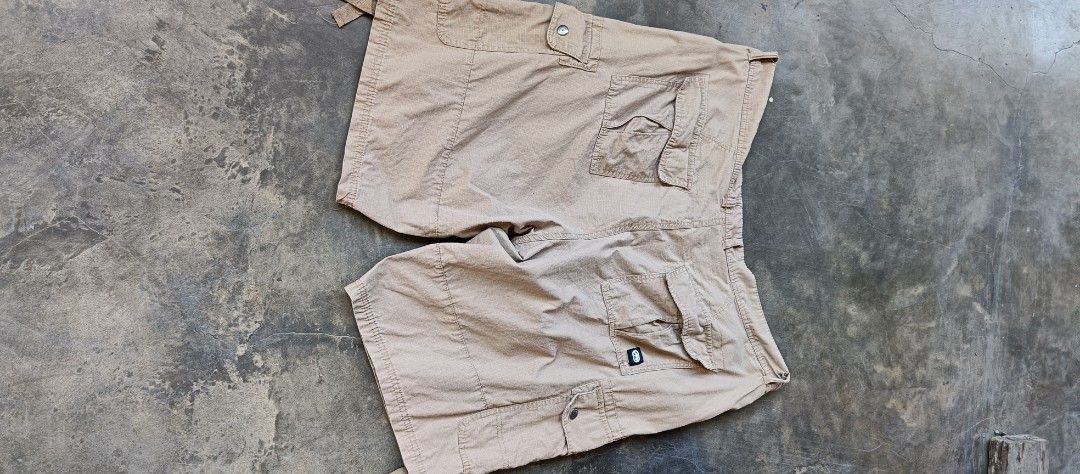 Ecko Unltd Cargo Shorts Beige Size 38 (Category: Shorts) located in Manila. Submitted by sandobag (Listing ID 1465819941, Image 3). Description: - Size: W 40-42 L 23 -Excellent condition - Color rate:10/10 Tan cargo shorts from Ecko Unltd. Size 38 on the tag, 100 percent cotton material made in Bangladesh. Multiple pockets on the sides and back, button closure, belt loops. Ecko branding patch on the left cargo pocket and embroidered logo above th