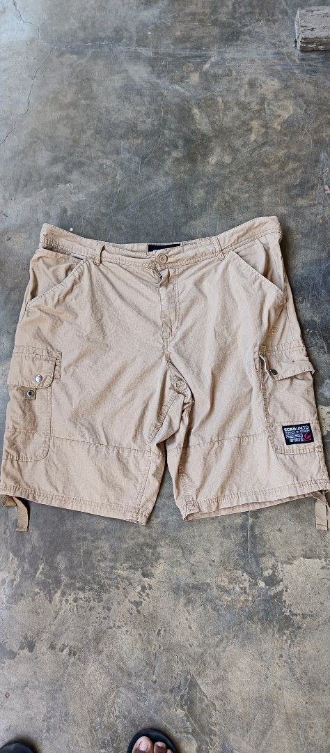 Ecko Unltd Cargo Shorts Beige Size 38 (Category: Shorts) located in Manila. Submitted by sandobag (Listing ID 1465819941, Image 1). Description: - Size: W 40-42 L 23 -Excellent condition - Color rate:10/10 Tan cargo shorts from Ecko Unltd. Size 38 on the tag, 100 percent cotton material made in Bangladesh. Multiple pockets on the sides and back, button closure, belt loops. Ecko branding patch on the left cargo pocket and embroidered logo above th