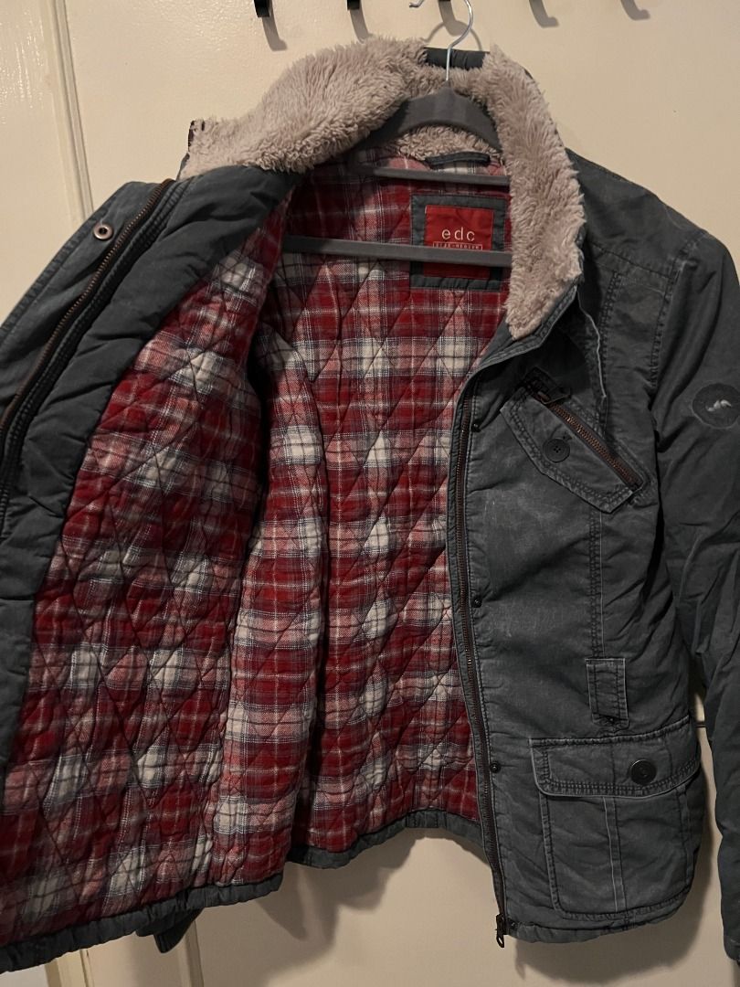 EDC dark grey winter jacket with red plaid lining [j3] (Category: Coats, Jackets and Outerwear) located in Pasig City. Submitted by awesamfinds (Listing ID 1465839385, Image 3). Description: - Color: Dark grey with red and white plaid quilted lining - Closure: Zip and button front closure with a neck buckle strap - Collar: Warm fuzzy collar - Pockets: Multiple chest and lower front pockets with button flaps - Details: Quilted detailing on sleeves