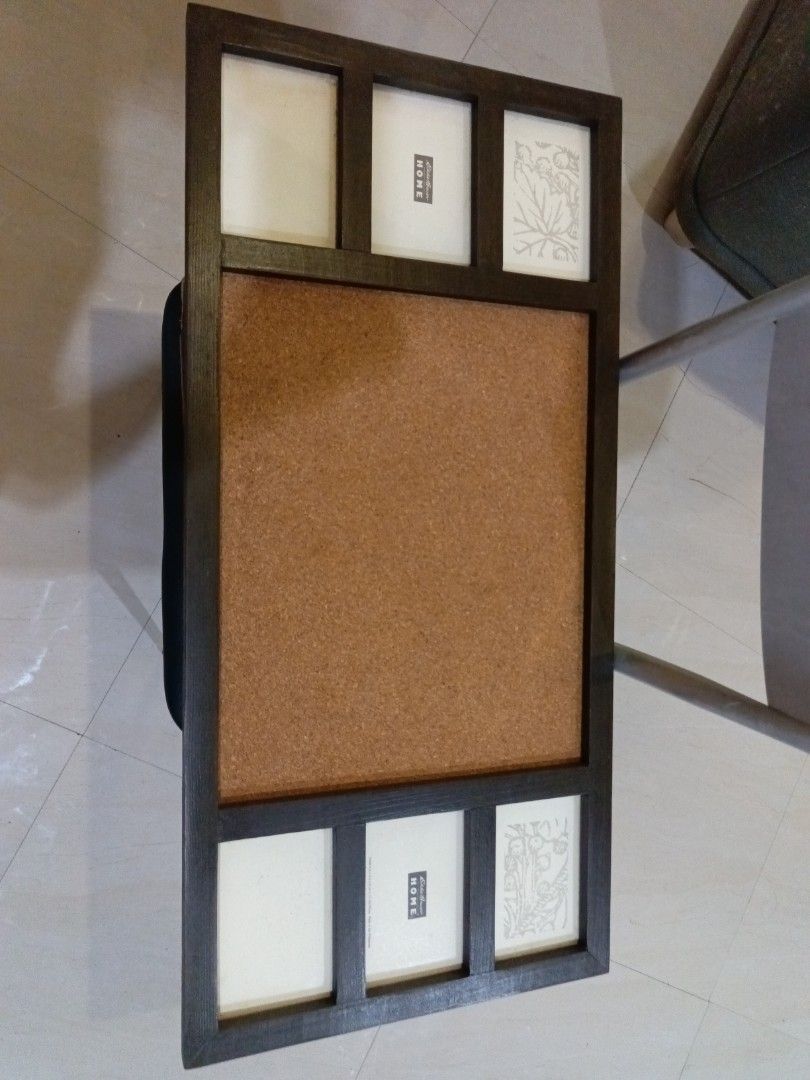 Eddie Bauer Home Cork Board with Photo Frames (Category: Frames & Pictures) located in San Juan City. Submitted by pinkdenxel (Listing ID 1465828277, Image 1). Description: - Brand: Eddie Bauer Home - Design: Dark wooden frame featuring a central cork board and 6 picture slots (top and bottom) - Features: Includes sample decorative inserts and ready to hang - Purpose: Great organizational piece for notes, reminders, and photos.