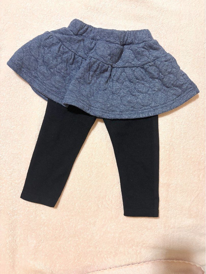 Elfindoll Classic skort leggings (Category: Babies & Kids Fashion) located in Quezon City. Submitted by closettreasure123 (Listing ID 1465857676, Image 2). Description: 12-18months It features a textured, circle-quilted chambray blue skirt with a small decorative satin bow on the front, attached directly to plain black stretch leggings underneath..