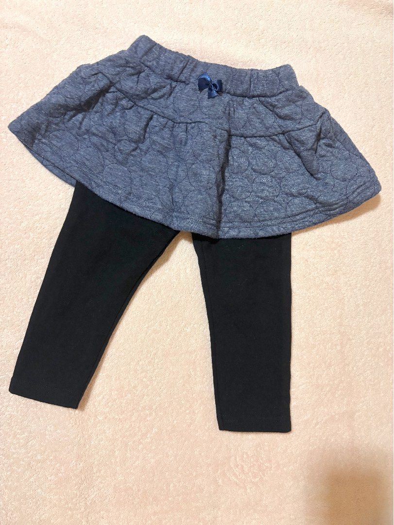 Elfindoll Classic skort leggings (Category: Babies & Kids Fashion) located in Quezon City. Submitted by closettreasure123 (Listing ID 1465857676, Image 1). Description: 12-18months It features a textured, circle-quilted chambray blue skirt with a small decorative satin bow on the front, attached directly to plain black stretch leggings underneath..