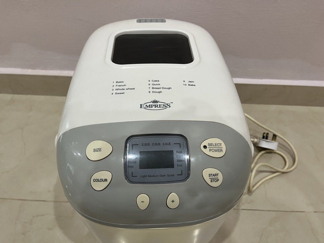 Empress Automatic Bread Maker Machine (Category: Breadmakers) located in Kuala Lumpur. Submitted by brightphoenix_e24909 (Listing ID 1465900867, Image 3). Description: - Empress automatic bread maker with a sleek grey top control panel - Multiple digital settings including basic, french, cake, quick, and jam - Generous capacity with size options up to 3.0 LB - Non-stick inner baking pan equipped with a dual paddle system and metal handle - Built-