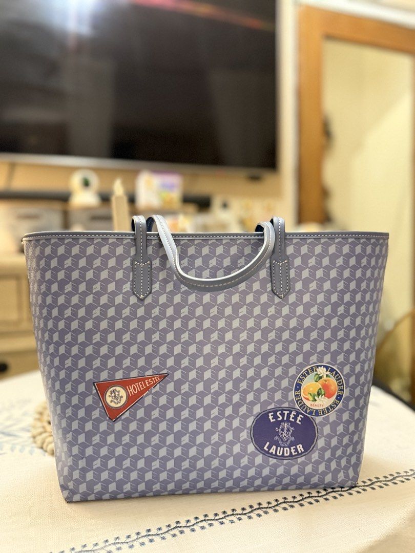 Estée Lauder Tote Bag with Pouch Blue Geometric Pattern (Category: Tote Bags) located in Quezon City. Submitted by cndcvrtc (Listing ID 1465945673, Image 2). Description: - Brand: Estée Lauder promotional set (Tote bag and matching zip pouch) - Design: Stylish blue geometric cube pattern with cute decorative patches (red hotel pennant and citrus fruit) - Features: Double shoulder straps on the tote and a wristlet strap on the pouch - Condition: C