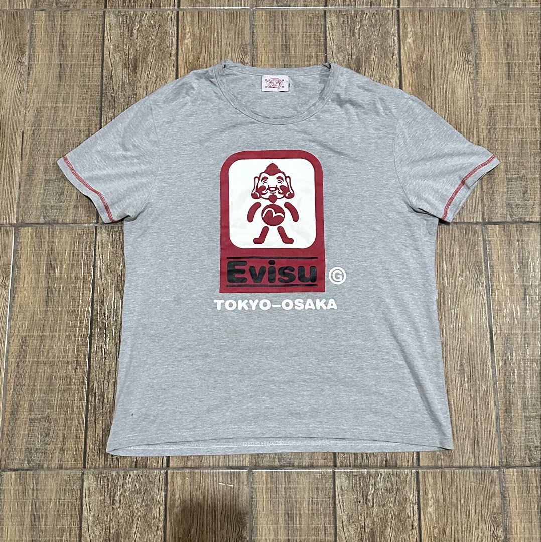EVISU SHIRT (Category: Tshirts & Polo Shirts ) located in Manila. Submitted by urban-vintage_2 (Listing ID 1465780426, Image 1). Description: ISSUE: NONE ( NEED WASH ) MOP :GCASH ( NO COD ) SHIP VIA : LALAMOVE & J&T LOCATION : PASIG CITY LENGTH : 27 WIDTH : 22.