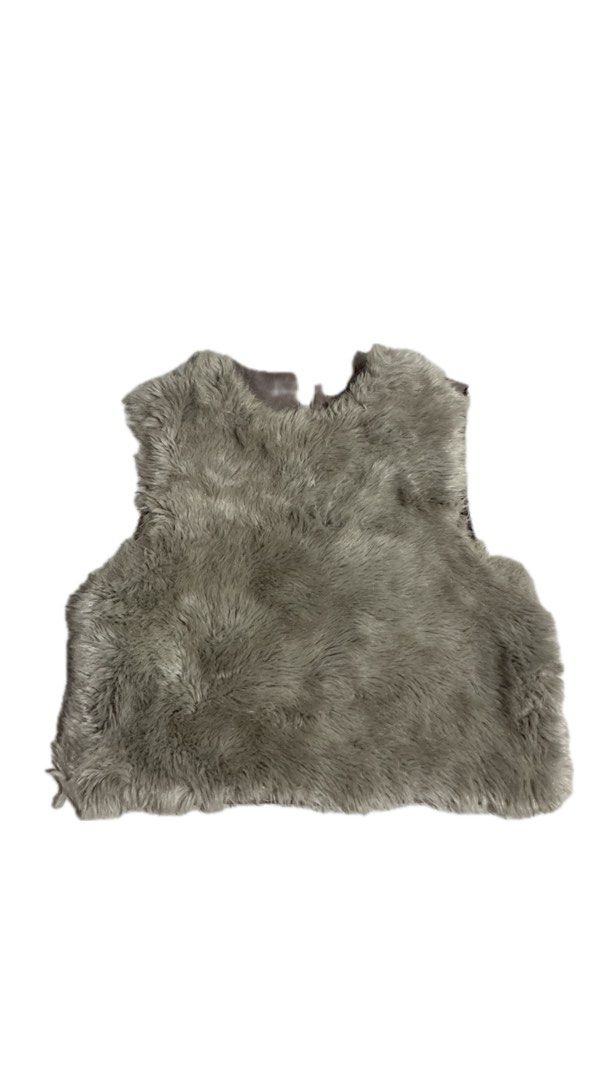 Faux Fur Grey Vest With Back Buckle Strap (Category: Sleeveless) located in La Trinidad. Submitted by ezraaaa29 (Listing ID 1465861000, Image 1). Description: - Color: Grey Size: small to medium - Material: Soft fluffy faux fur front with a suede-like back - Design: Open front, sleeveless layering piece - Details: Adjustable waist strap with metal ring closure - Condition: Great pre-loved condition - Perfect for: Cold weather OOTDs and stylish la