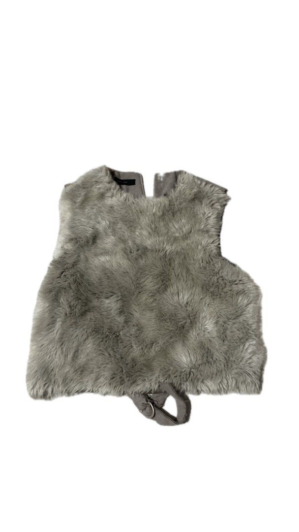 Faux Fur Grey Vest With Back Buckle Strap (Category: Sleeveless) located in La Trinidad. Submitted by ezraaaa29 (Listing ID 1465861000, Image 2). Description: - Color: Grey Size: small to medium - Material: Soft fluffy faux fur front with a suede-like back - Design: Open front, sleeveless layering piece - Details: Adjustable waist strap with metal ring closure - Condition: Great pre-loved condition - Perfect for: Cold weather OOTDs and stylish la