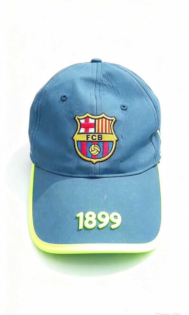 FC Barcelona Official Merchandise Baseball Cap (Category: Caps & Hats) located in Manila. Submitted by josephlim13 (Listing ID 1465428503, Image 1). Description: - Official FC Barcelona merchandise ('Producte Oficial' tag) - Dark grey colorway with striking neon yellow trim - Embroidered club crest on the front and '1899' detail on the brim - 'FC Barcelona' text printed across the adjustable back strap - Clean fabric showing only normal signs of 