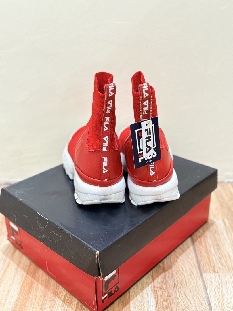 Fila Disruptor Stretch Red (Category: Sneakers) located in Quezon City. Submitted by cndcvrtc (Listing ID 1465939356, Image 2). Description: - Brand: Fila Disruptor Stretch Sock Sneakers - Color: Red and White - Size: US 7 / EUR 38 / UK 4.5 - Design: High-top stretch knit upper, slip-on style, chunky platform sole, and bold collar logo - Extras: Branded heel pull tabs - Condition: Brand new with original box and attached product tag.
