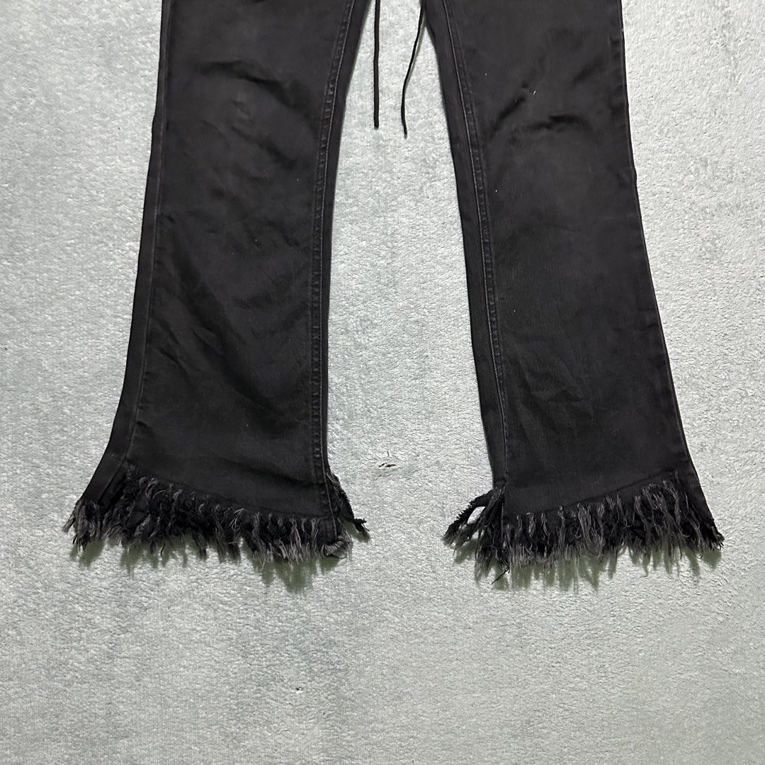 Five Plus Black Lace-Up Fringe Hem Jeans (Category: Jeans) located in Villaverde. Submitted by bakatzy_secondhand_garments (Listing ID 1465886591, Image 3). Description: - Brand: Five Plus - Color: Black - Style: High-waisted, flare leg, Y2K / edgy aesthetic - Details: Front lace-up closure, raw frayed edges on waistband and hems - Pockets: Functional back pockets included.