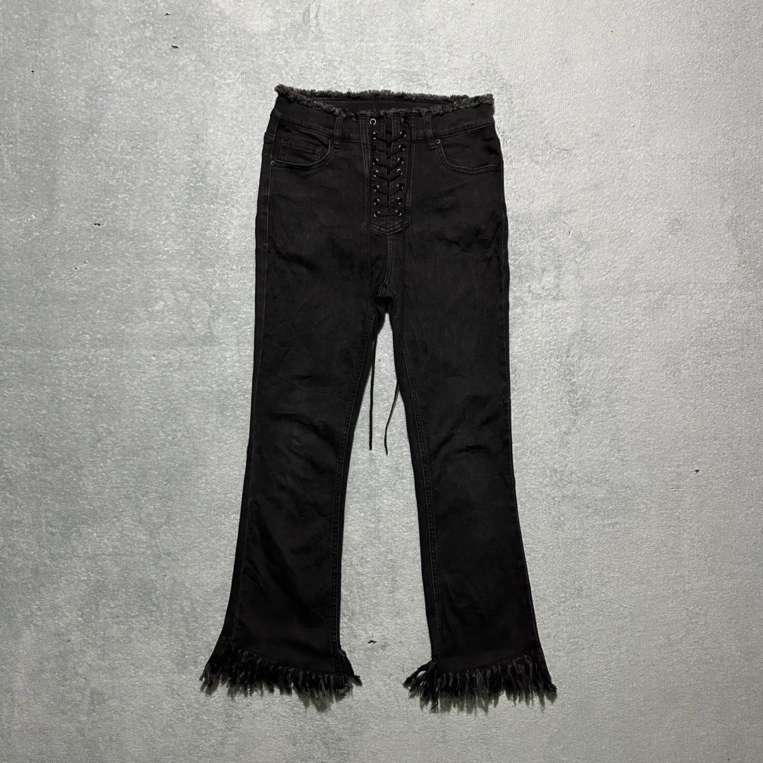 Five Plus Black Lace-Up Fringe Hem Jeans (Category: Jeans) located in Villaverde. Submitted by bakatzy_secondhand_garments (Listing ID 1465886591, Image 1). Description: - Brand: Five Plus - Color: Black - Style: High-waisted, flare leg, Y2K / edgy aesthetic - Details: Front lace-up closure, raw frayed edges on waistband and hems - Pockets: Functional back pockets included.