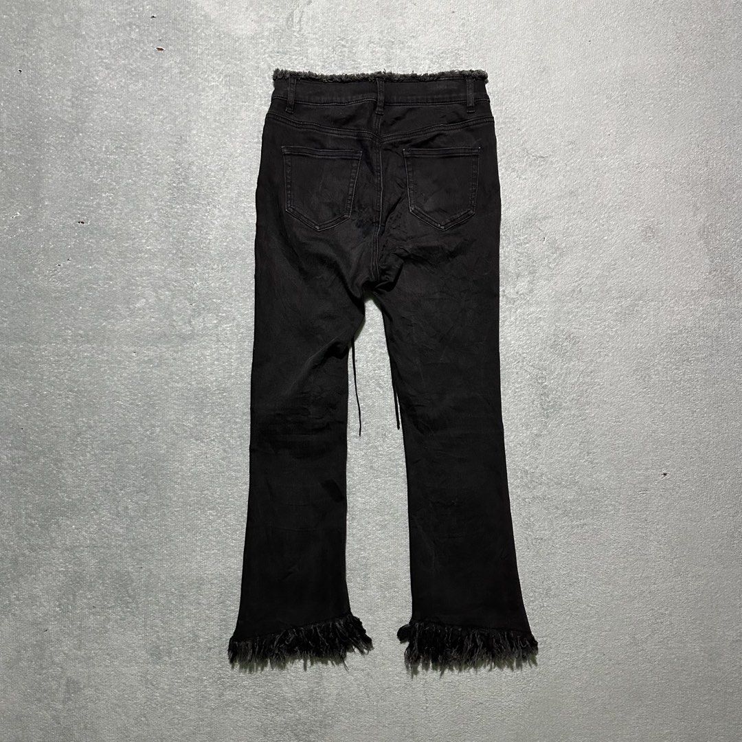 Five Plus Black Lace-Up Fringe Hem Jeans (Category: Jeans) located in Villaverde. Submitted by bakatzy_secondhand_garments (Listing ID 1465886591, Image 2). Description: - Brand: Five Plus - Color: Black - Style: High-waisted, flare leg, Y2K / edgy aesthetic - Details: Front lace-up closure, raw frayed edges on waistband and hems - Pockets: Functional back pockets included.