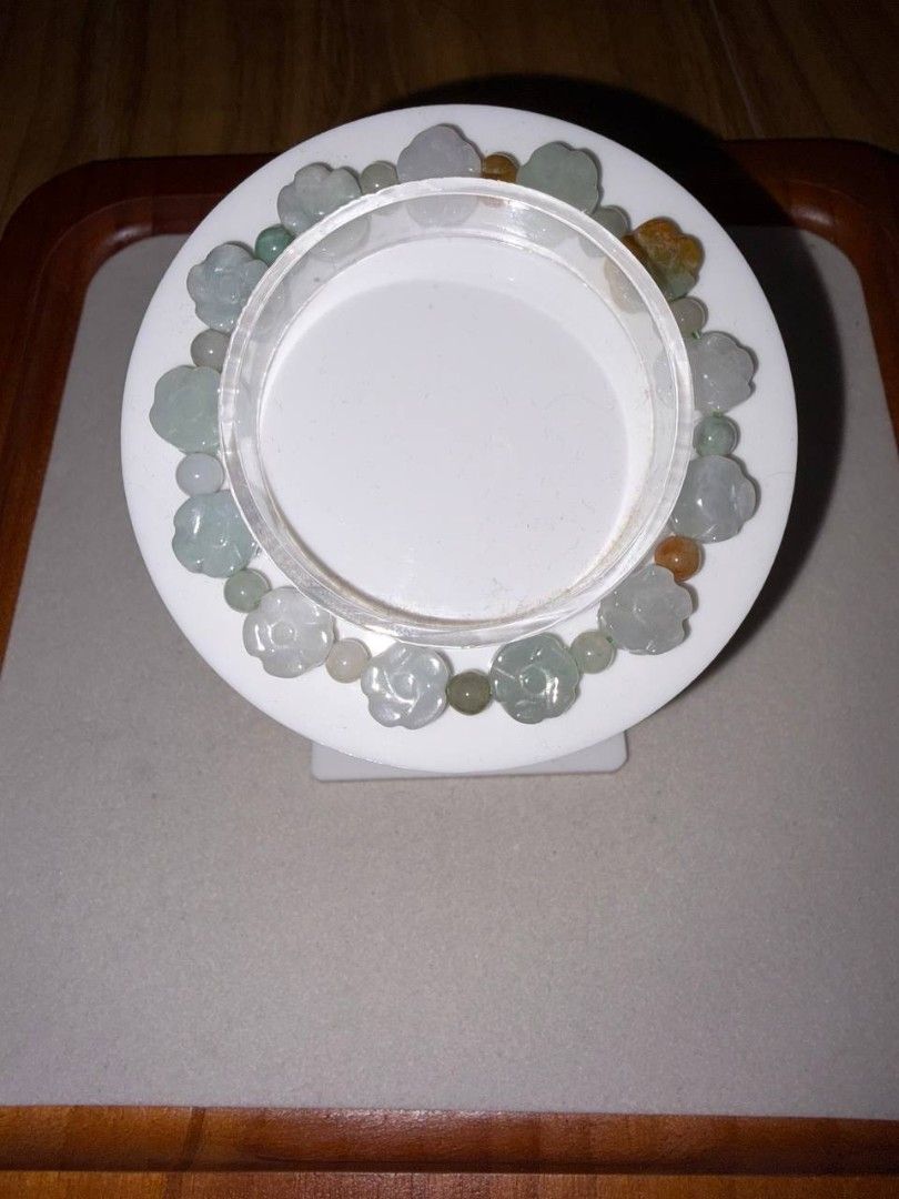 Flower carved Jadeite bracelet (Category: Bracelets) located in Santa Rosa. Submitted by crystal1.0 (Listing ID 1465805260, Image 1). Description: - Material: Genuine carved flower jade with green, grey, and brownish-orange accent beads - Design: Traditional Chinese carved stone jewelry - Fit: Elastic stretch band, fits standard wrist sizes easily - Style: Elegant, versatile, and easy to slip on and off.