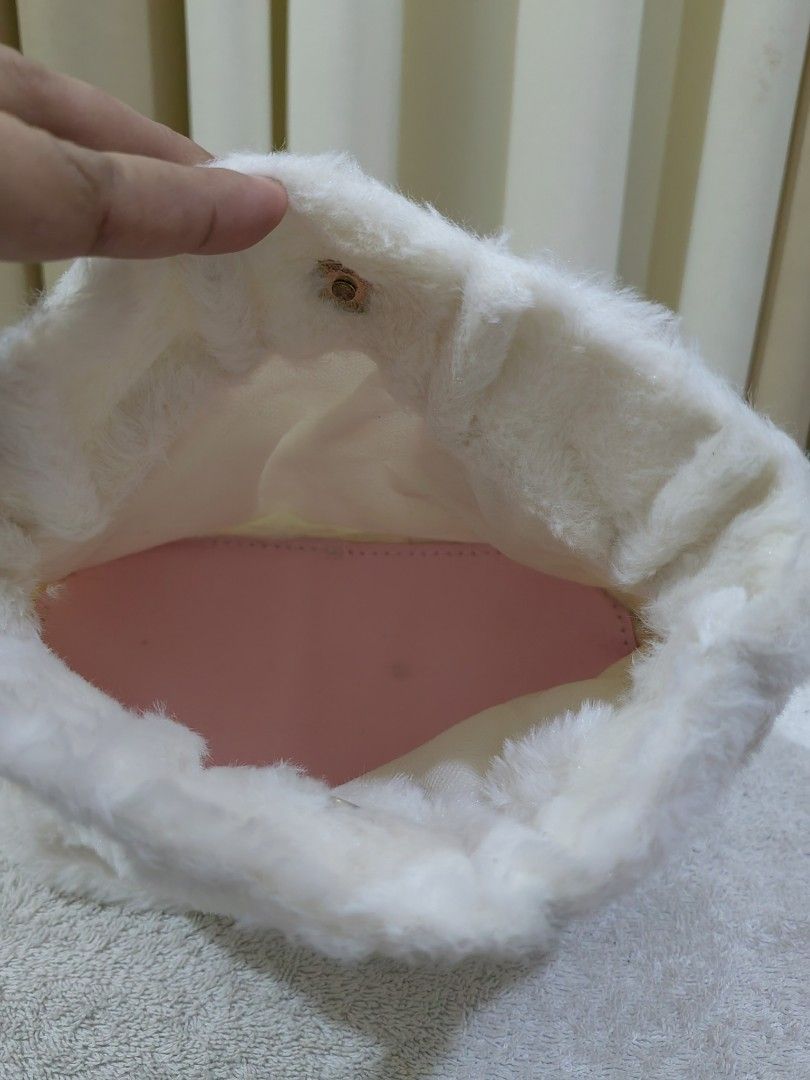 Fluffy white plush Pouch (Category: Purses & Pouches) located in Makati City. Submitted by prelovedtreatedwithlove (Listing ID 1465768362, Image 2). Description: - Super soft and fluffy white faux fur - Adorable pink rabbit ears detail and matching pink inner lining - Secure top magnetic snap closure - Perfect cute accessory for casual days or make up organizer for travel -Free na ung fur handbag - just need wash. -A-218.