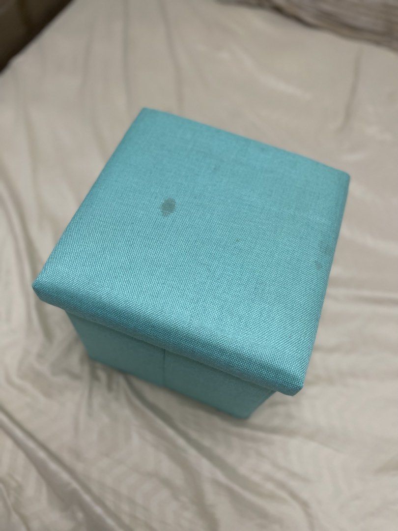 FOLDABLE STORAGE BOX STOOL/OTTOMAN (Category: Storage Boxes & Baskets) located in Tarlac. Submitted by wowsinigangmix (Listing ID 1465890457, Image 2). Description: FOLDABLE STORAGE BOX STOOL/OTTOMAN COLOR BLUE GREEN HAS LIGHT STAINS ON THE COVER NEEDS CLEANING DUE TO STORAGE PLEASE MANAGE EXPECTATIONS.