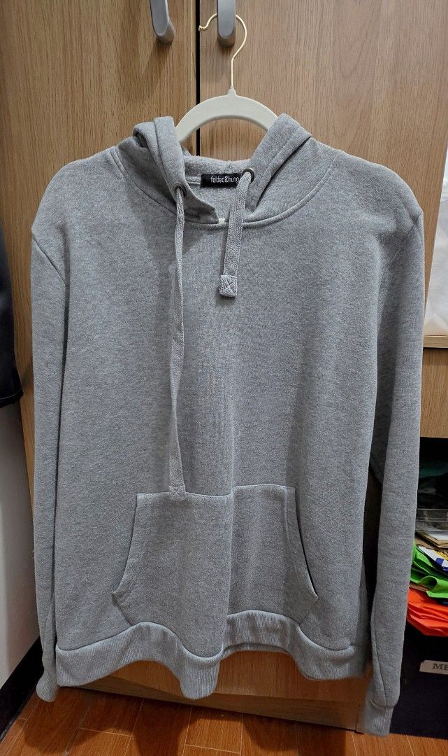Folded & Hung Grey Hoodie (Category: Hoodies) located in Manila. Submitted by tori_mama21 (Listing ID 1465814809, Image 1). Description: - Brand: Folded & Hung - Color: Classic Grey - Style: Pullover hoodie with matching drawstring - Features: Front kangaroo pocket, ribbed hem and cuffs - Condition: Light pilling across the body from previous wear - Fit: Comfortable and easy to style for everyday use.