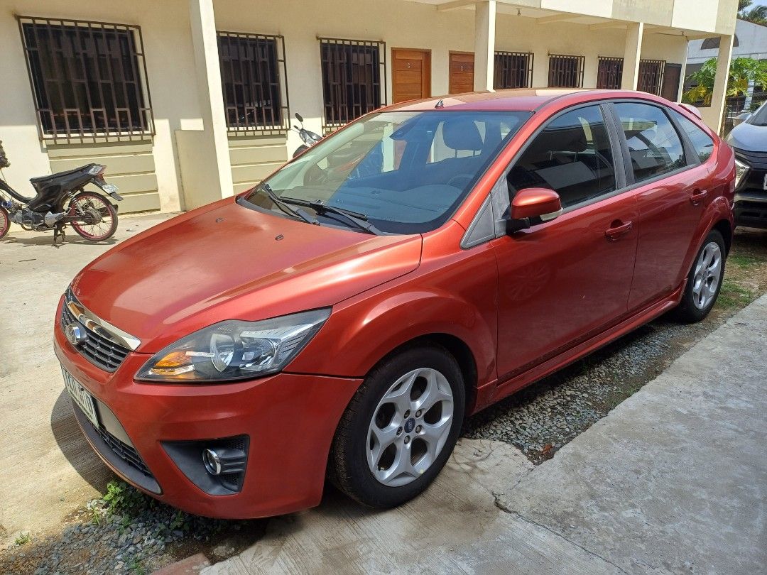 Ford Focus 2.0 Hatchback Auto (Category: Used Cars) located in Silang. Submitted by nrous.ph (Listing ID 1465822119, Image 3). Description: Just passed 80,000km on my very well taken care of Ford Focus Red sport. I own it since 42,000 km. I regularly maintain it. Non smoking. Good smell. Safety triangle, fire extinguisher, spare wheel and wheel changing tools provided. Registered/insured until October 2027. Honest issues: It has some scratches an