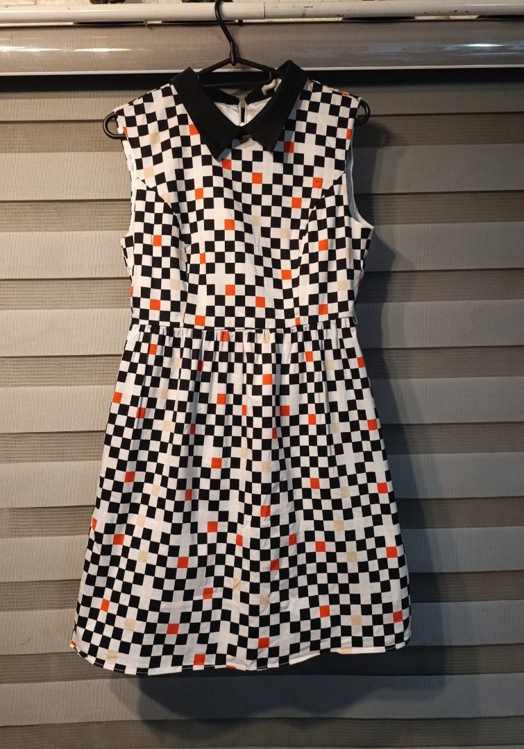 Forever 21 Checkered Dress with Black Collar (Category: Dresses) located in Manila. Submitted by yunicool (Listing ID 1465916919, Image 1). Description: - Brand: Forever 21 - Size: Medium (M) - Design: Black and white checkered pattern with cute orange pops & contrasting black pointed collar - Cut: Fitted waist with a flattering flared skirt - Style Tip: Super versatile—easy to dress up with heels or down with sneakers! - Condition: Well-maintain