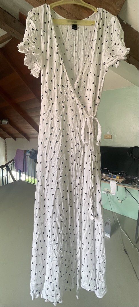 Forever 21 White Polka Dot Wrap Dress (Category: Dresses) located in Baybay. Submitted by shikita27906 (Listing ID 1465841525, Image 3). Description: - Brand: Forever 21 - Style: Midi wrap dress with V-neckline and side tie waist - Pattern: White with classic black polka dots - Details: Short sleeves with cute ruffled cuffs - Fabric: Lightweight and breathable - Size: S (tag still attached).
