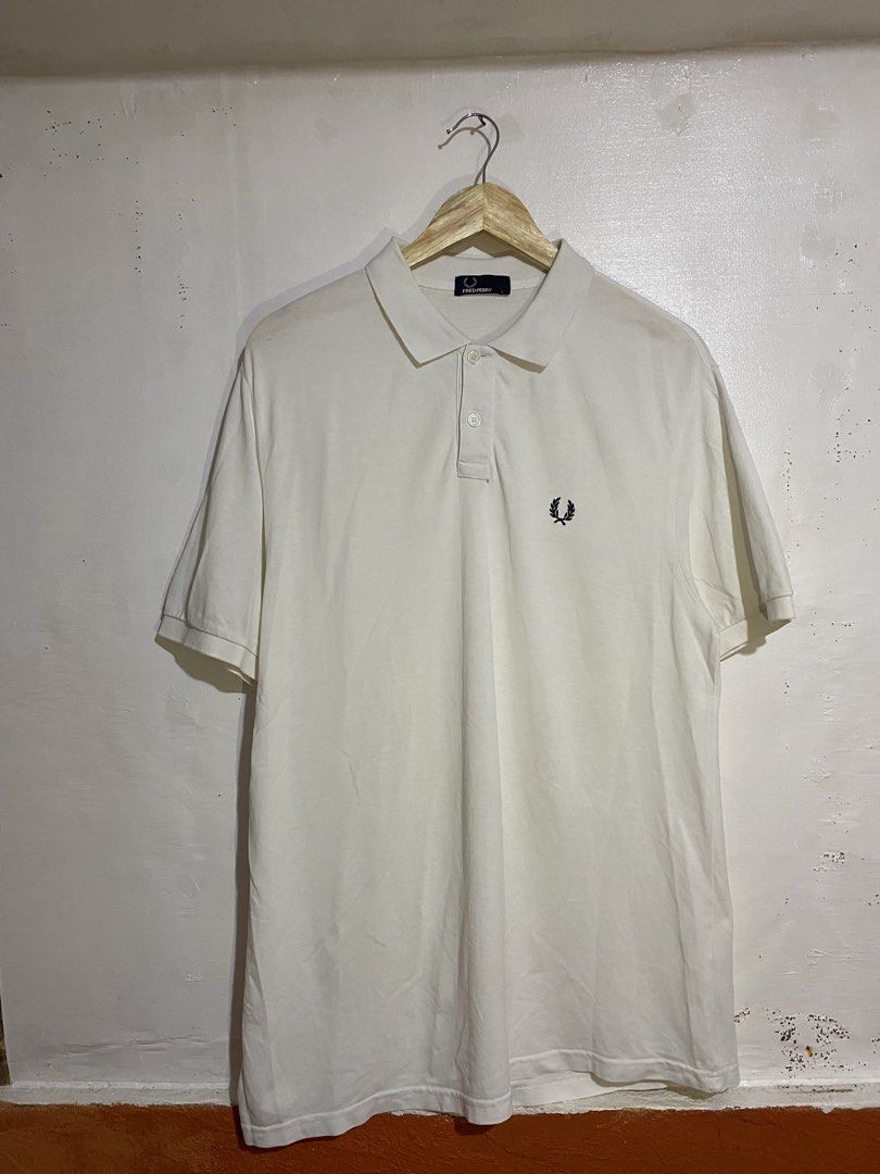 FREDPERRY POLO SHIRT (Category: Tshirts & Polo Shirts ) located in Cebu City. Submitted by arsenyong (Listing ID 1465918554, Image 1). Description: 21 width 30 length Very good condition Issue:last pic pinhole 9/10 color ate Need wash only .