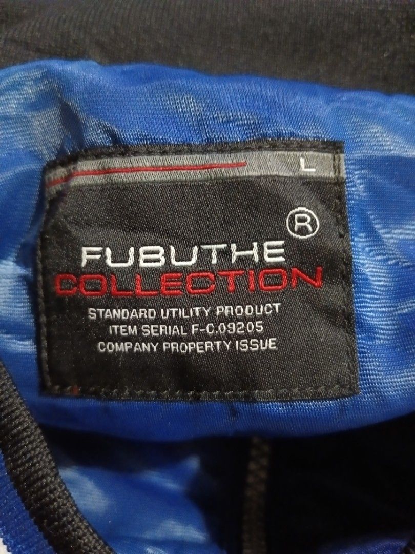 Fubu The Collection Ford Racing Bomber Jacket Size L (Category: Coats, Jackets and Outerwear) located in General Santos City (Dadiangas). Submitted by freehorse.5f2a61 (Listing ID 1465918798, Image 3). Description: - Brand: Fubu The Collection - Style: Racing jacket with blue and black colorway - Size: L (Tag included) - Design details: Ford and SVT chest branding, NASCAR Nextel Cup right sleeve print, and big number 92 with Fubu Jeans Mustang ba
