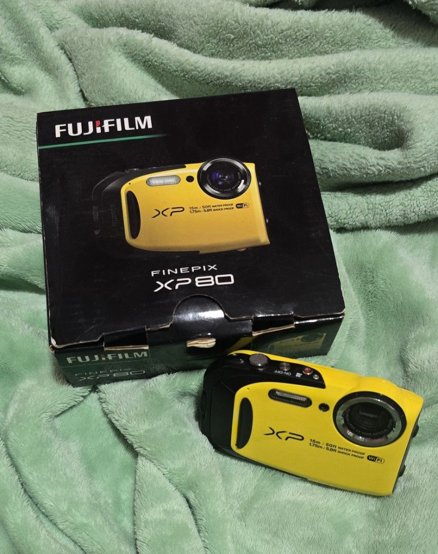 Fujifilm FinePix XP80 Waterproof Digital Camera Yellow (Category: Cameras) located in Manila. Submitted by calonzoiss12752 (Listing ID 1465880484, Image 1). Description: - Model: Fujifilm FinePix XP80 (Bright Yellow) - Condition: Fully functional, clear screen, excellent working order - Durability: Waterproof up to 15 meters and shockproof - Features: Built-in Wi-Fi for quick and easy photo transfers - Inclusions: Original box, power adapter, and