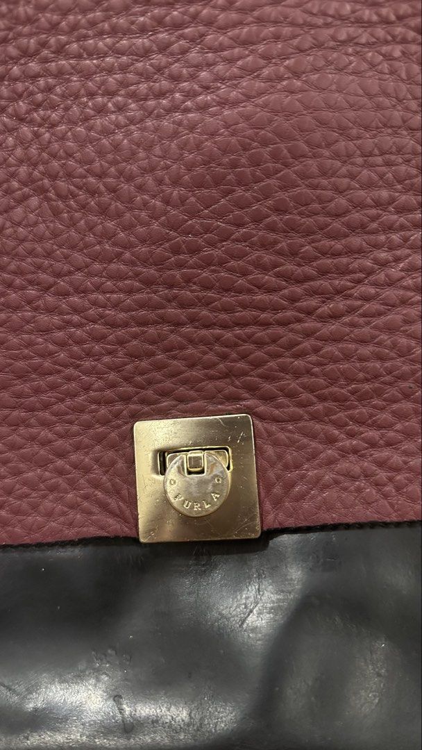 FURLA Leather Handbag (Category: Luxury Bags & Wallets) located in Muntinlupa City. Submitted by pgba_ (Listing ID 1465891591, Image 2). Description: * Genuine leather feel * Spacious interior — fits 13” Laptop *Can be handbag or shoulderbag * Signs of wear from previous use, especially on the handles — please see photos * More photos available upon request; please DM if you’d like to see additional photos * Thrifted this piece so authenticity is