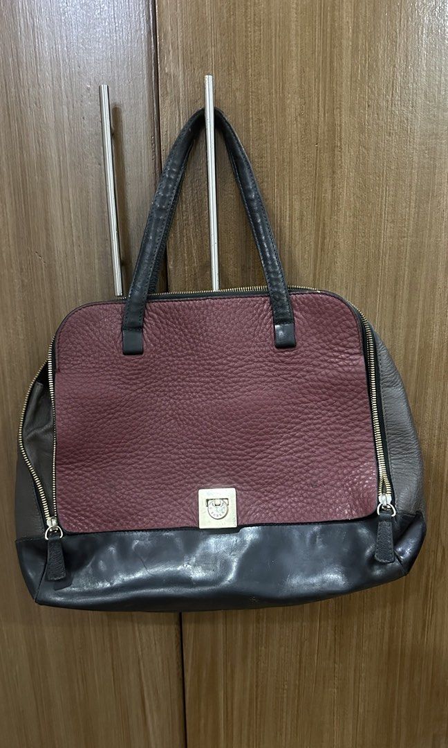 FURLA Leather Handbag (Category: Luxury Bags & Wallets) located in Muntinlupa City. Submitted by pgba_ (Listing ID 1465891591, Image 1). Description: * Genuine leather feel * Spacious interior — fits 13” Laptop *Can be handbag or shoulderbag * Signs of wear from previous use, especially on the handles — please see photos * More photos available upon request; please DM if you’d like to see additional photos * Thrifted this piece so authenticity is