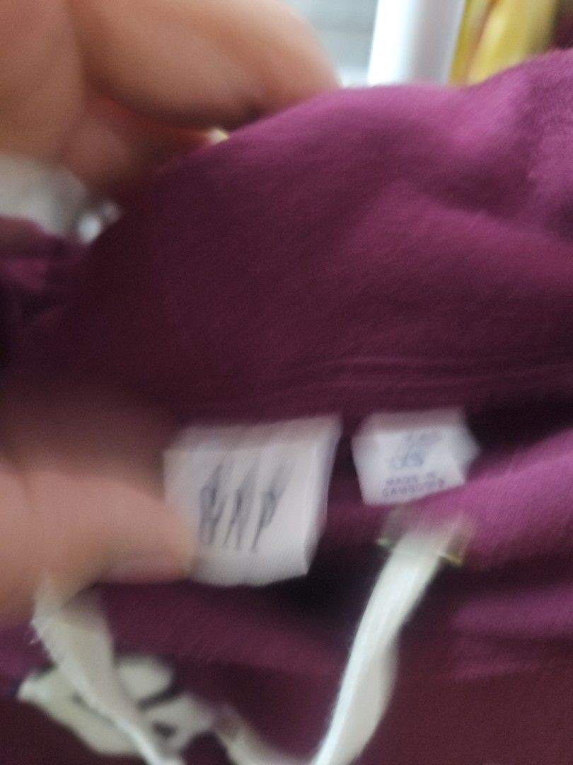 GAP Maroon Hoodie with Front Pocket (Category: Coats, Jackets and Outerwear) located in Calamba. Submitted by handpickedbynetty (Listing ID 1465831285, Image 2). Description: - Authentic GAP hoodie in a rich maroon color - Large white appliqued GAP logo on the chest - Adjustable drawstring hood with white cords - Classic front kangaroo pocket - Ribbed cuffs and hem for a snug fit - Soft and cozy cotton blend material - Ideal for casual, everyday 