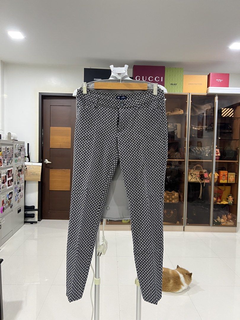 Gap Patterned Trousers Slim Fit Pants (Category: Trousers) located in Manila. Submitted by imprincessg888 (Listing ID 1465859081, Image 3). Description: - Brand: Gap - Style: Slim fit trousers with a tailored leg and mid-rise waist - Pattern: Black and white geometric print - Fabric: Lightweight with a slight stretch for comfort - Condition: Clean and well-maintained - Versatility: Ideal for office wear or smart casual outfits.