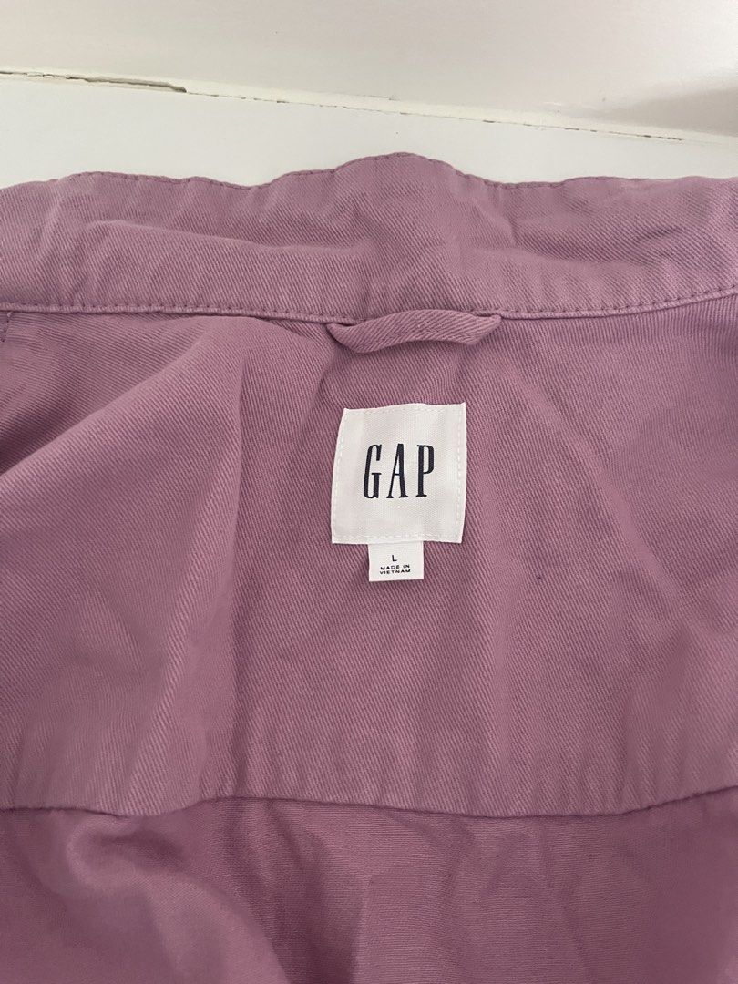 Gap Purple Utility Jacket (Category: Coats, Jackets and Outerwear) located in Quezon City. Submitted by cooperminie (Listing ID 1465816092, Image 3). Description: - Brand: Gap - Style: Utility Jacket - Color: Dusty Purple - Size: L - Material: Solid cotton twill - Closure: Full zip front with snaps - Pockets: Functional chest and side pockets - Fit: Adjustable drawstring waist.