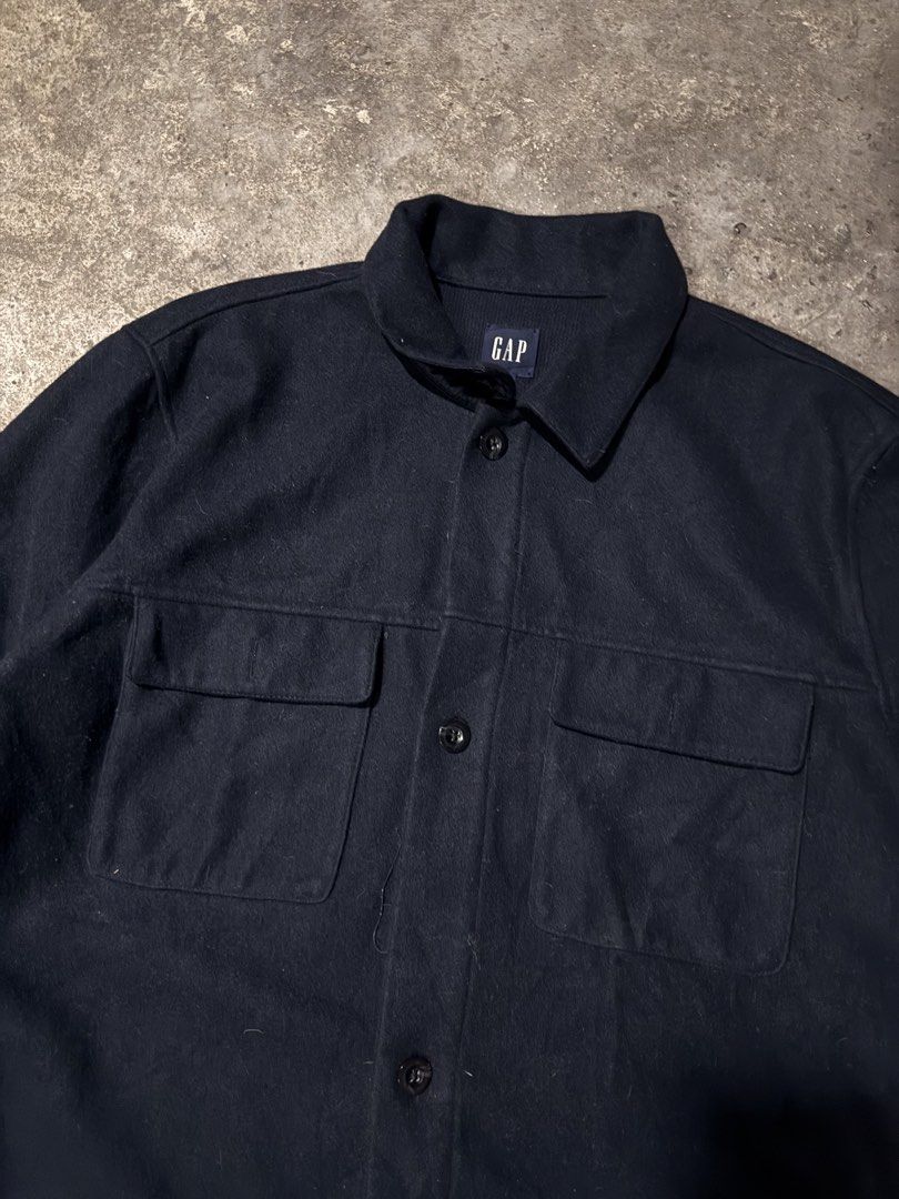 Gap Wool Blend Overshirt Navy Blue Size L (Category: Coats, Jackets and Outerwear) located in Pasig City. Submitted by dripthrift1600 (Listing ID 1465950214, Image 3). Description: - Brand: Gap - Color: Dark Navy Blue - Size: Large - Material: Acrylic, polyester, and wool blend - Features: Button-up front, standard collar, two chest pockets - Origin: Made in Vietnam - Condition/Use: Great layering piece for cooler weather - Dimes: 23x30.