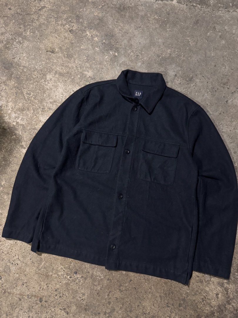 Gap Wool Blend Overshirt Navy Blue Size L (Category: Coats, Jackets and Outerwear) located in Pasig City. Submitted by dripthrift1600 (Listing ID 1465950214, Image 1). Description: - Brand: Gap - Color: Dark Navy Blue - Size: Large - Material: Acrylic, polyester, and wool blend - Features: Button-up front, standard collar, two chest pockets - Origin: Made in Vietnam - Condition/Use: Great layering piece for cooler weather - Dimes: 23x30.