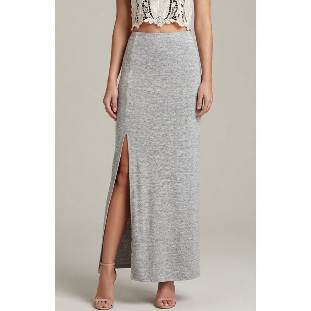George Maxi Skirt high slit (Category: Skirts) located in Quezon City. Submitted by rosepam (Listing ID 1465856372, Image 1). Description: George Heathered Gray Knit Maxi Skirt Side slit (24") Size on tag: M Elastic waist 29-40 *some dirt/stain sa bottom/hem FIX PRICE Measurements posted for reference *Stored item sa closet (pls wash before wearing, light colored - may have some dirt or stain/s due to storage).