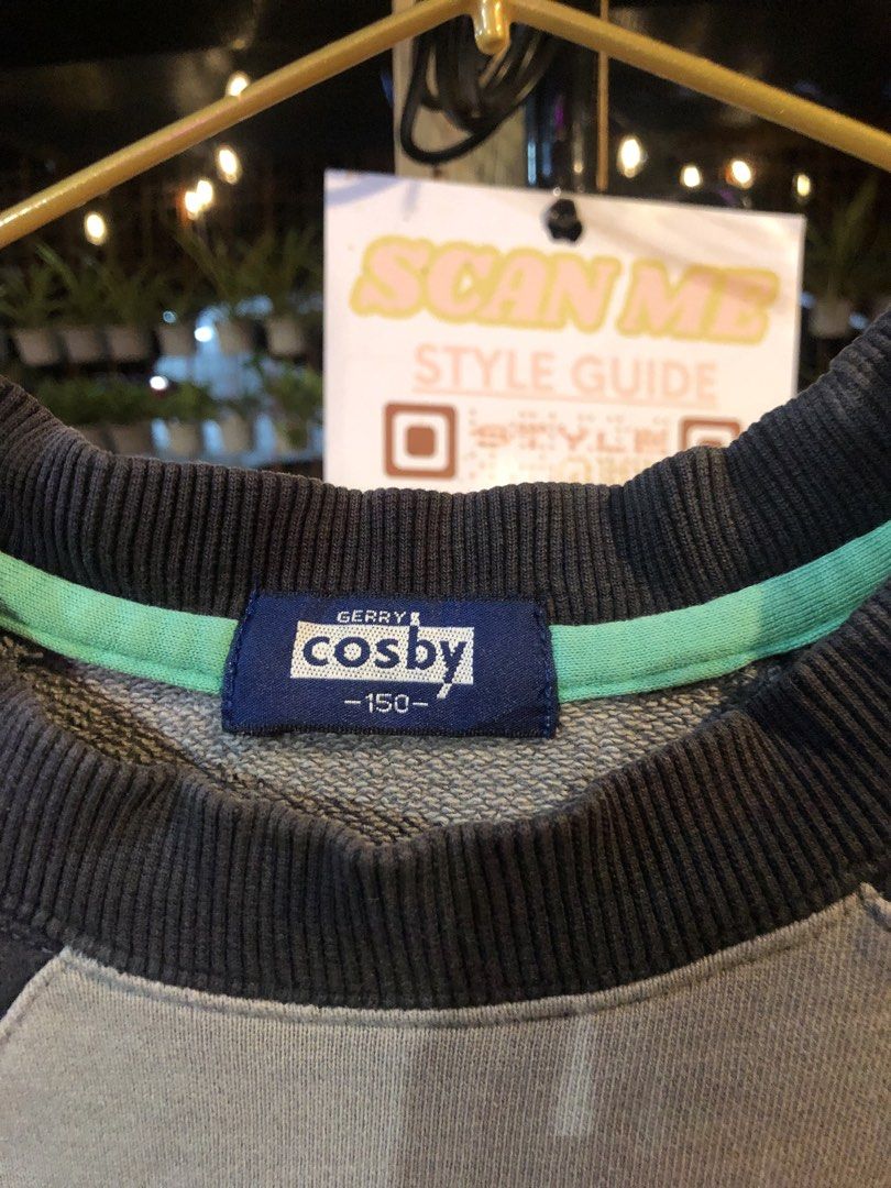 Gerry Cosby Gray Sweatshirt Size 150 (Category: Coats, Jackets and Outerwear) located in Cauayan City . Submitted by wholly.craaaft (Listing ID 1465876023, Image 3). Description: - Brand: Gerry Cosby - Size: 150 tag - Color: Gray with dark side panels and mint green collar trim - Design: Large Cosby Madison Square Garden front graphic and athletic text on left sleeve - Details: Crewneck, ribbed cuffs and hem.