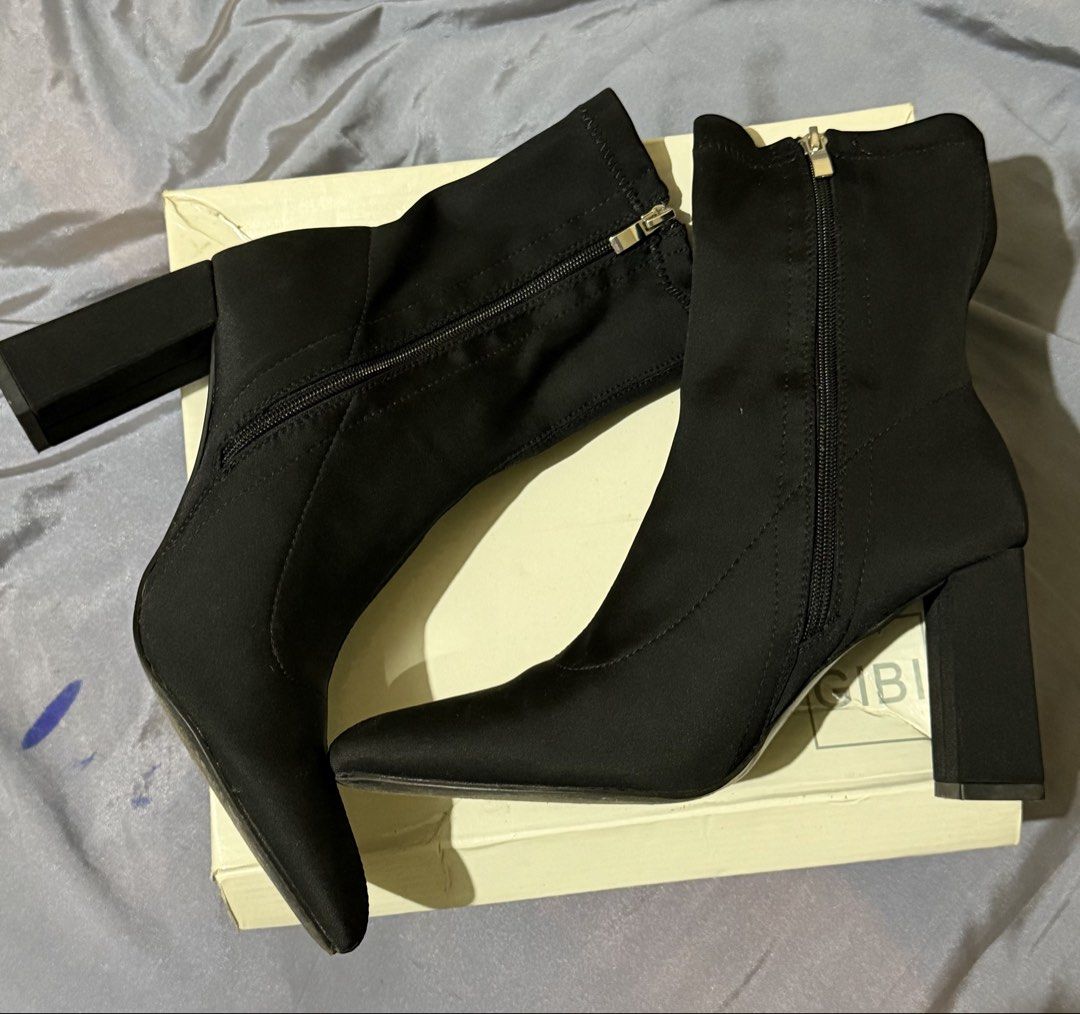 Gibi Black Block Heel Ankle Boots (Category: Boots) located in Caloocan City. Submitted by amberbear12 (Listing ID 1465812551, Image 1). Description: - Brand: Gibi - Color: Classic Black - Style: Ankle boots with a stylish pointed toe and trendy chunky block heel - Material: Soft stretch fabric that comfortably hugs your ankles - Closure: Side zippers equipped with sleek metallic pulls for easy wear - Inclusion: Comes with the original shoe box -