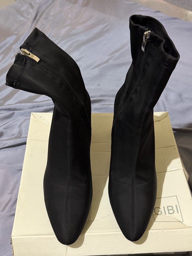 Gibi Black Block Heel Ankle Boots (Category: Boots) located in Caloocan City. Submitted by amberbear12 (Listing ID 1465812551, Image 2). Description: - Brand: Gibi - Color: Classic Black - Style: Ankle boots with a stylish pointed toe and trendy chunky block heel - Material: Soft stretch fabric that comfortably hugs your ankles - Closure: Side zippers equipped with sleek metallic pulls for easy wear - Inclusion: Comes with the original shoe box -