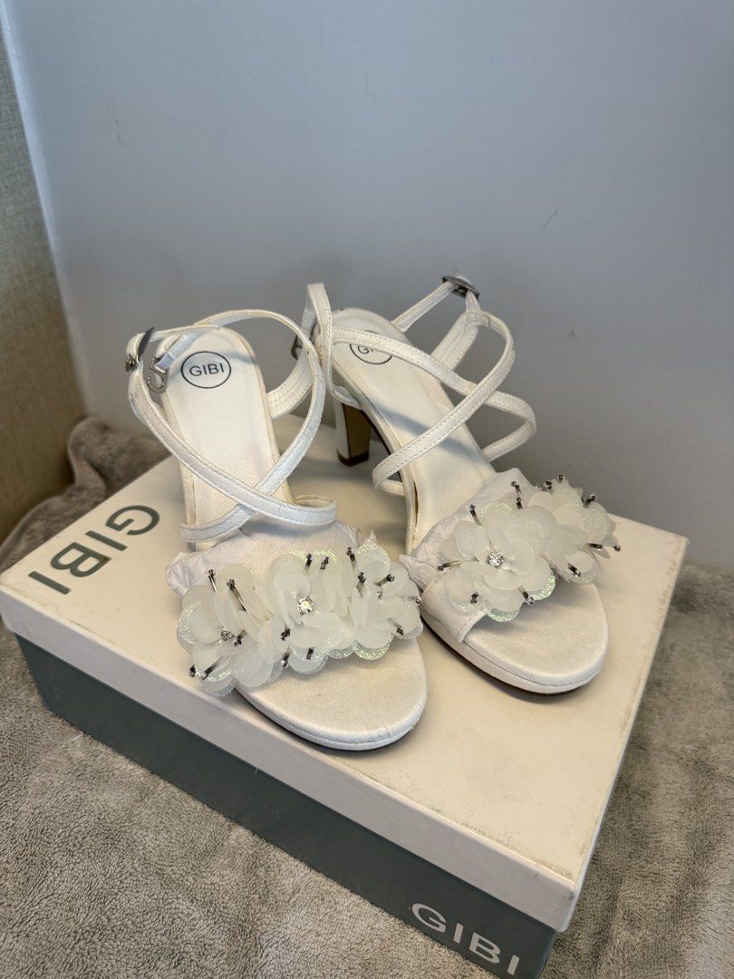 Gibi Medea White Floral Heels Size 35 (Category: Heels) located in Santa Rosa. Submitted by alyssa21 (Listing ID 1465953661, Image 2). Description: - Brand: Gibi Medea - Style: Strappy heels with floral & rhinestone toe strap - Color: White - Size: 35 - Condition:used only in pictorial - Inclusions: Original box with tag - Original Price: ₱2,299.75.