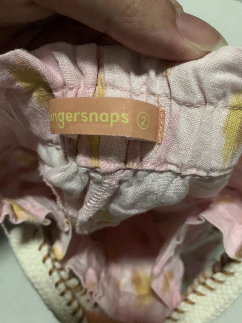 Gingersnaps Pink Printed Shorts with Belt Size 2 (Category: Babies & Kids Fashion) located in Malabon City. Submitted by vewonica (Listing ID 1465811665, Image 3). Description: - Brand: Gingersnaps - Size: 2 (Toddler) - Design: Pink shorts with yellow brushstroke prints - Waistband: Elasticated back with single front button closure - Extra: Includes a thick knitted belt with playful pink tassels and pom-poms - Comfort: Made from soft, toddler-fri