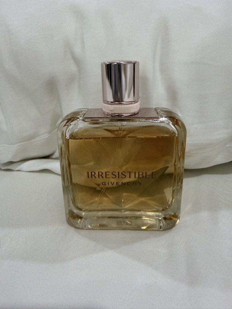 Givenchy Irresistible Eau de Parfum (Category: Fragrance & Deodorants) located in Quezon City. Submitted by alexaswardrobe (Listing ID 1465928778, Image 3). Description: - Authentic Givenchy Irresistible Eau de Parfum (Made in France) - Volume: Approximately 80% remaining (natural golden amber tint from aging) - Scent Profile: Fruity-floral with crisp pear, rose, and cedarwood - Batch Code: 3G01 (stamped on base) - Condition: Spray nozzle works p