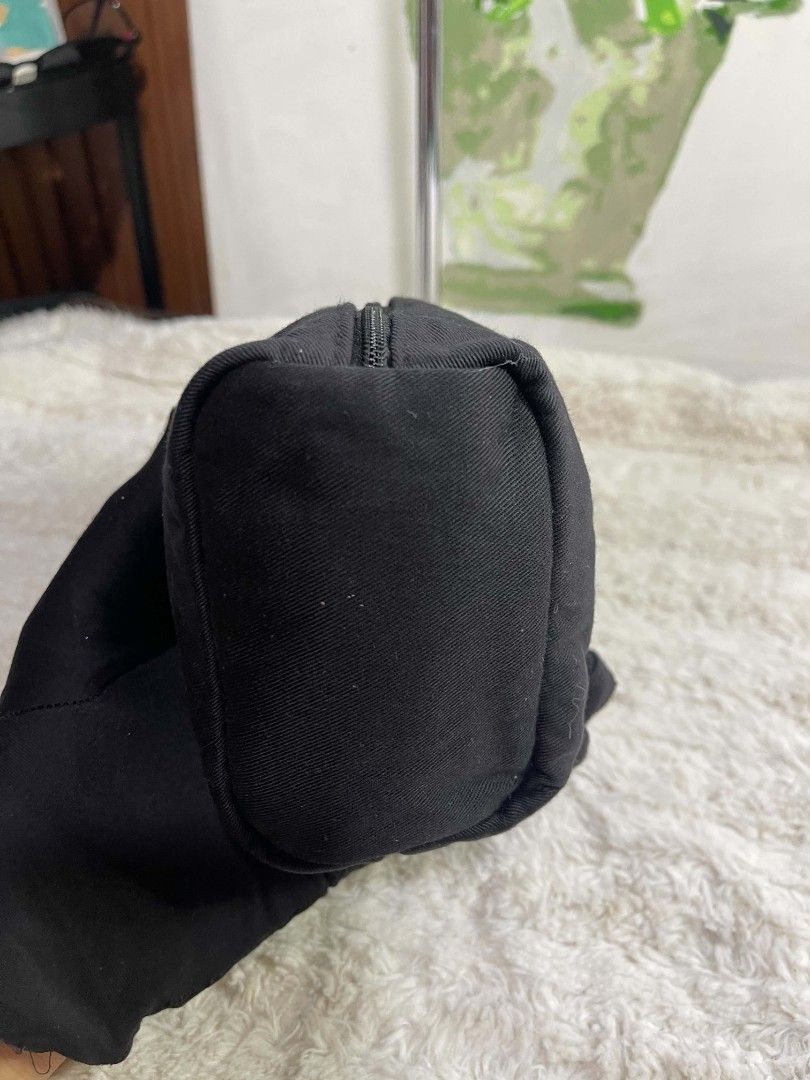 Givenchy Parfums Black Canvas Toiletry Makeup Pouch Bag (Category: Luxury Bags & Wallets) located in Naawan. Submitted by twilly.apparel2 (Listing ID 1465840665, Image 2). Description: - Brand: Givenchy Parfums - Material: Durable black canvas with smooth branded inner lining - Design: Embroidered logo patch on the front with a stylish circular silver zipper pull - Storage: Main zipper compartment plus a convenient inner zipper pocket - Use: Hand