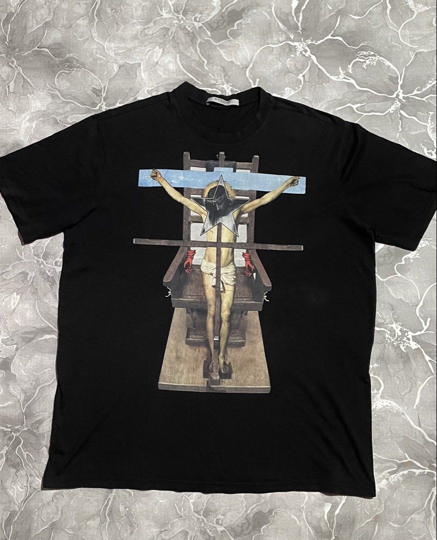 Givenchy Paris Black Graphic T-Shirt (Category: Announcements) located in Manila. Submitted by fastrabbit.d03390 (Listing ID 1465953430, Image 1). Description: - Brand: Givenchy Paris Givenchy Crucifix / Electric Chair T-Shirt - SS16 by Ricardo Tisci It’s a true piece of fashion history - one of the most recognizable Givenchy tees from the Ricardo Tisci era. Discontinued & sold out - no longer in production; now an archive/ collector’s item Dimes