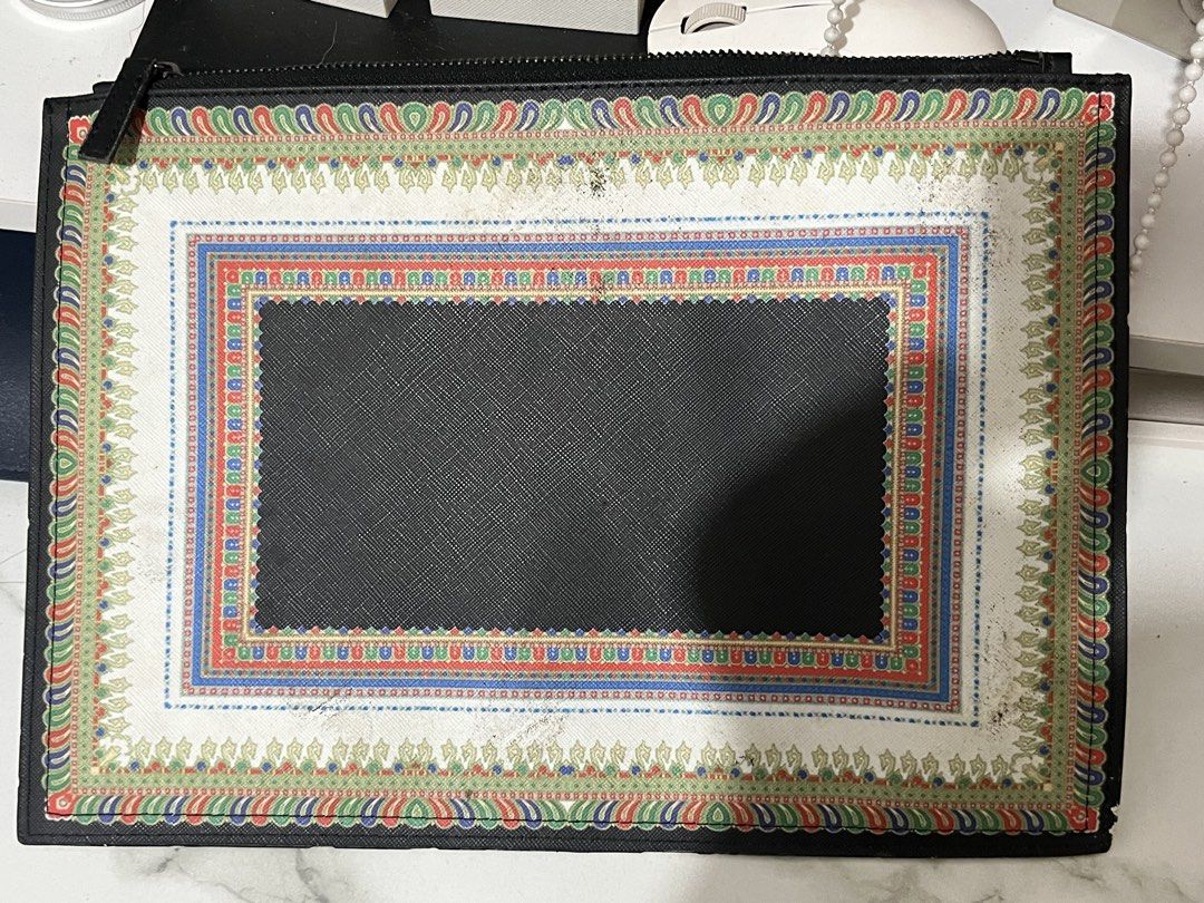 RUSH RUSH RUSH!! Givenchy zip pouch/clutch or document-style bag (Category: Purses & Pouches) located in Taguig. Submitted by mailipang758544 (Listing ID 1465854295, Image 3). Description: Givenchy zip pouch/clutch or document-style bag The important thing is the condition: there is noticeable wear, especially the peeling/chipping at the corners, discoloration/staining on the fabric, and general signs of age. The zipper and Givenchy plaque still 
