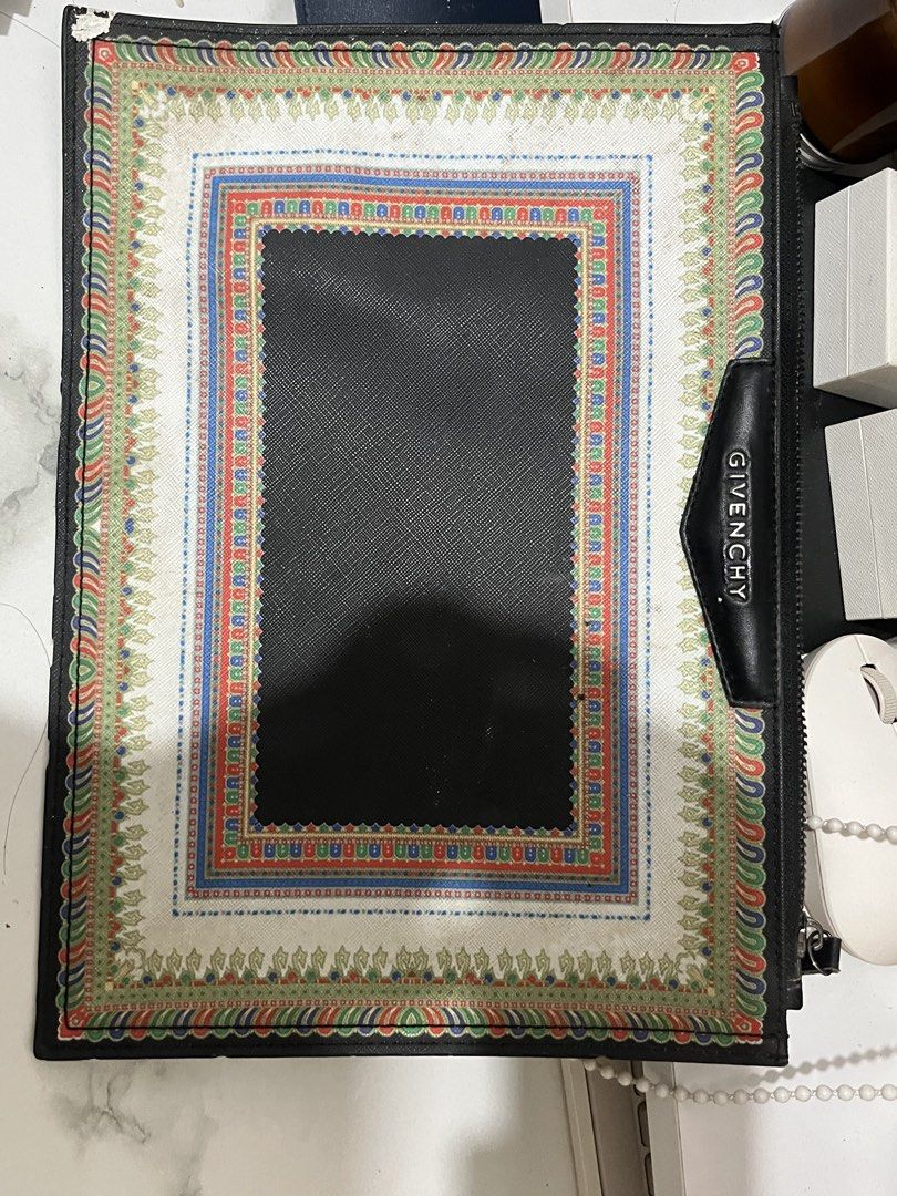 RUSH RUSH RUSH!! Givenchy zip pouch/clutch or document-style bag (Category: Purses & Pouches) located in Taguig. Submitted by mailipang758544 (Listing ID 1465854295, Image 2). Description: Givenchy zip pouch/clutch or document-style bag The important thing is the condition: there is noticeable wear, especially the peeling/chipping at the corners, discoloration/staining on the fabric, and general signs of age. The zipper and Givenchy plaque still 