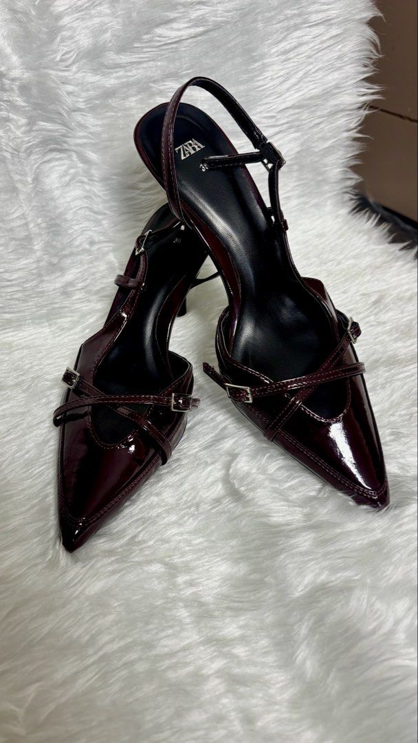 Glossy Burgundy Patent Heels (Category: Heels) located in Manila. Submitted by vintage_og_bagash (Listing ID 1465815065, Image 3). Description: Glossy Burgundy Patent Heels • Condition: Good as new • Heel Height: 2.5 inches • Details: Pointed toe, criss-cross buckle straps, and a sleek slingback design • Material/Finish: High-gloss patent finish (smooth, mirror-like, and water-resistant coating) • Size: [Insert size] • Color: Deep burgundy / oxbl