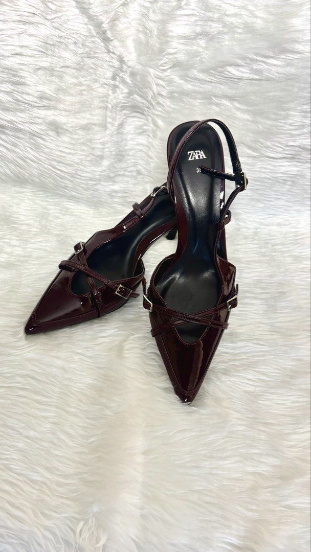 Glossy Burgundy Patent Heels (Category: Heels) located in Manila. Submitted by vintage_og_bagash (Listing ID 1465815065, Image 1). Description: Glossy Burgundy Patent Heels • Condition: Good as new • Heel Height: 2.5 inches • Details: Pointed toe, criss-cross buckle straps, and a sleek slingback design • Material/Finish: High-gloss patent finish (smooth, mirror-like, and water-resistant coating) • Size: [Insert size] • Color: Deep burgundy / oxbl