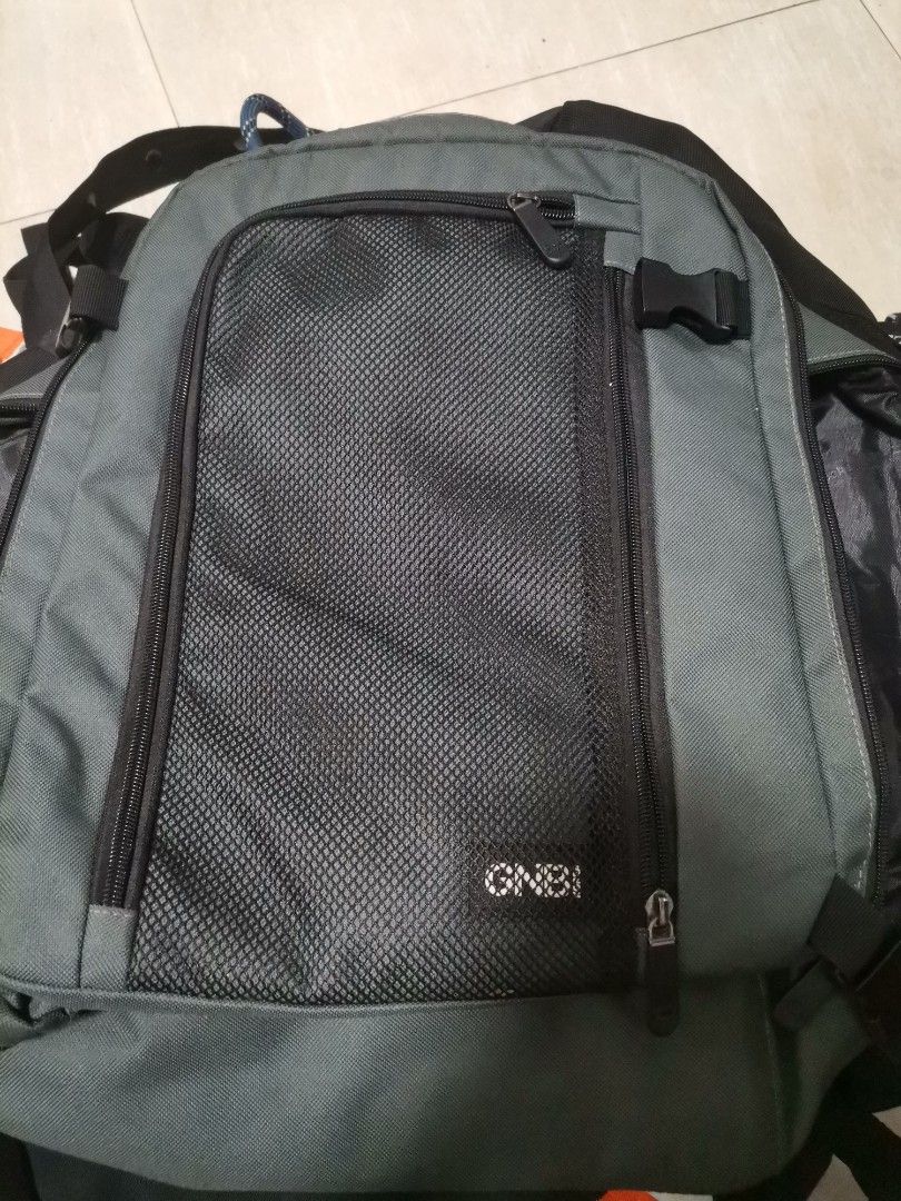 GNB Olive Green Travel Backpack (Category: Backpacks) located in Makati City. Submitted by kookybearsstuff (Listing ID 1465822574, Image 1). Description: - Brand: GNB - Color: Olive green - Versatile daily bag for school, work, or travel - Large main compartment for easy packing - Front section with zip mesh pocket and buckle strap - Padded black mesh back panel and shoulder straps for breathability - Convenient top handle and side grab handle.